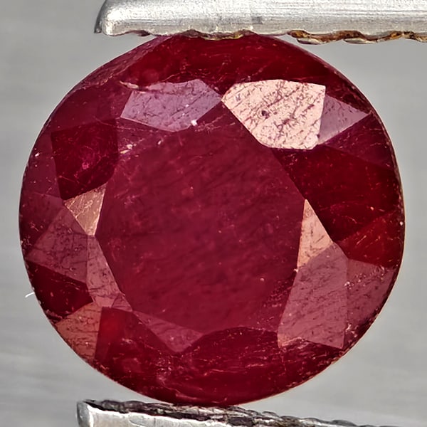 Natural Pinkish Red Ruby Gemstones 1.48 Ct. Round Shape 6.2 Mm.: Product ID: 805935868 Product Name: Natural Ruby Weight: 1.48 CT. Size: 6.2 x 6.2 x 5 MM. Shape: Round Color: Pinkish Red Clarity:SI1 Luster: Good Gems Origin: Madagascar Treatment: Heated (Lead-glass