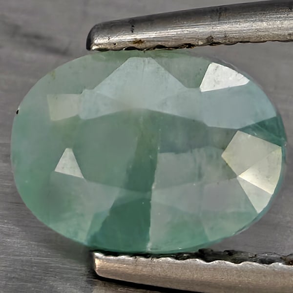 Natural Green Blueish Grandidierite Gemstones 2.20 Ct. Oval Shape 8.5 x 6.3 Mm.: Product ID: 803100046 Product Name: Natural Tsavorite Weight: 2.20 CT. Size: 8.5 x 6.3 x 5.3 MM. Shape: Oval Shape Color: Green Blueish Clarity:SI1 Luster: Good Gems Origin: Madagascar Treatment: Unhe
