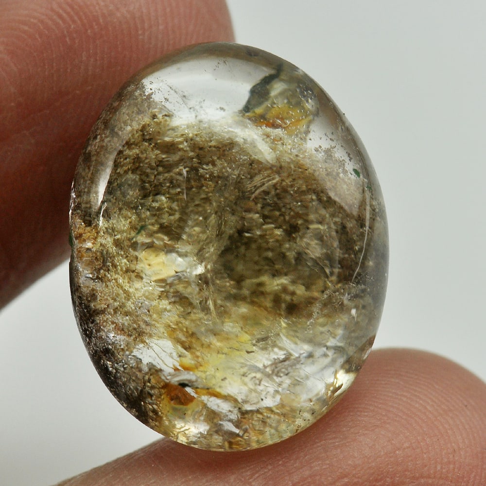 Natural Moss Quartz Gemstones 27.32 Ct. Oval Cabochon Shape 21 x 16.7 Mm.: Product ID: 805529452 Product Name: Natural Quartz Weight: 27.32 CT. Size: 21 x 16.7 x 11.5 MM. Shape: Oval Cabochon Color: White Clarity:Semi - Transparent Luster: Good Gems Origin: Thailand Treatmen