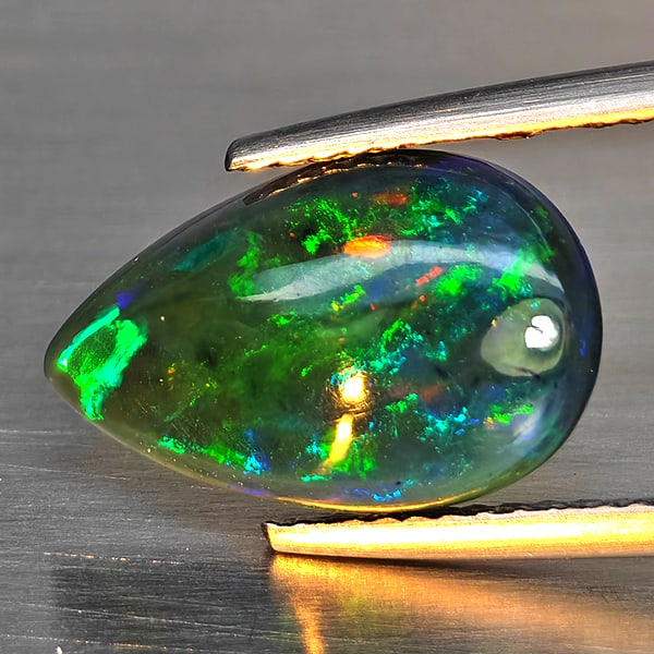 Natural Multi Color Play Of Color Rainbow Opal Gemstones 2.08 Ct. Pear Cabochon Shape 14.4 x 9 Mm.: Product ID: 818728642 Product Name: Natural Opal Weight: 2.08 CT. Size: 14.4 x 9 x 4.1 MM. Shape: Pear Cabochon Color: Multi-Color Clarity:Semi - Transparent Luster: Good Gems Origin: Ethiopia Treatme