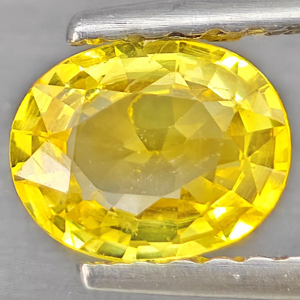 Natural Yellow Sapphire Gemstones 0.71 Ct. Oval Shape 6.1 x 4.9 Mm.: Product ID: 806162840 Product Name: Natural White Gold Weight: 0.71 CT. Size: 6.1 x 4.9 x 2.7 MM. Shape: Oval Shape Color: Yellow Clarity:VSI Luster: Good Gems Origin: Thailand Treatment: Heated Cryst