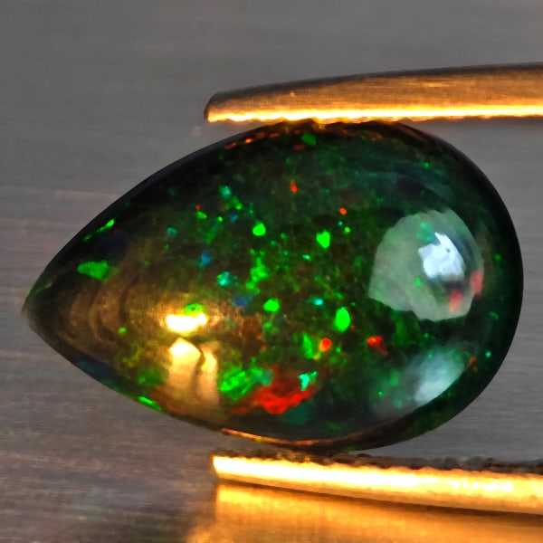 Natural Multi Color Play Of Color Rainbow Opal Gemstones 1.93 Ct. Pear Cabochon Shape 14.3 x 9.8 Mm.: Product ID: 818728644 Product Name: Natural Opal Weight: 1.93 CT. Size: 14.3 x 9.8 x 3.4 MM. Shape: Pear Cabochon Color: Multi-Color Clarity:Semi - Transparent Luster: Good Gems Origin: Ethiopia Treat
