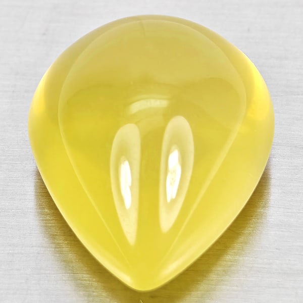 Natural Yellow Quartz Gemstones 31.48 Ct. Pear Cabochon Shape 22 x 18 Mm.: Product ID: 805530040 Product Name: Natural Quartz Weight: 31.48 CT. Size: 22 x 18 x 13.2 MM. Shape: Pear Cabochon Color: Yellow Lemon Clarity:Semi - Transparent Luster: Good Gems Origin: Brazil Treat