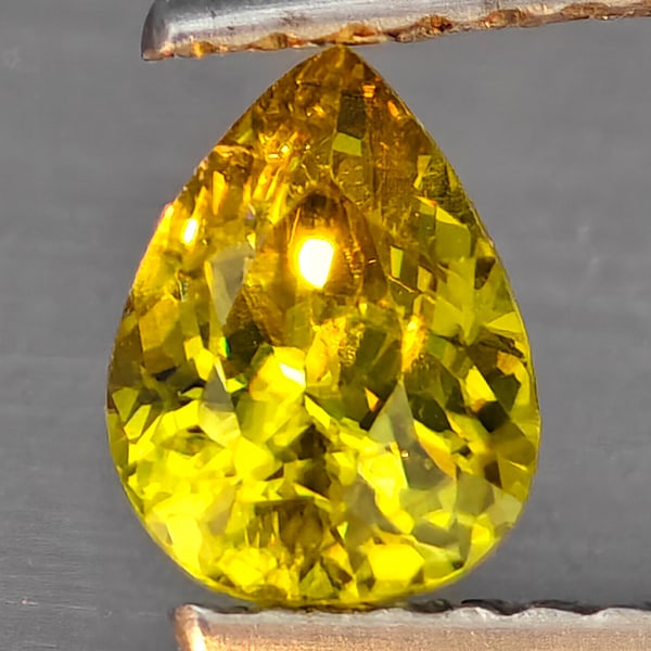 Natural Multi-Color With Rainbow Spark Sphene Gemstones 0.68 Ct. Pear Shape 6.4 x 5.4 Mm.: Product ID: 806509263 Product Name: Natural Sphene Weight: 0.68 CT. Size: 6.4 x 5.4 x 3.5 MM. Shape: Pear Shape Color: Multi-Color Clarity:SI1 Luster: Good Gems Origin: Madagascar Treatment: Unheated 
