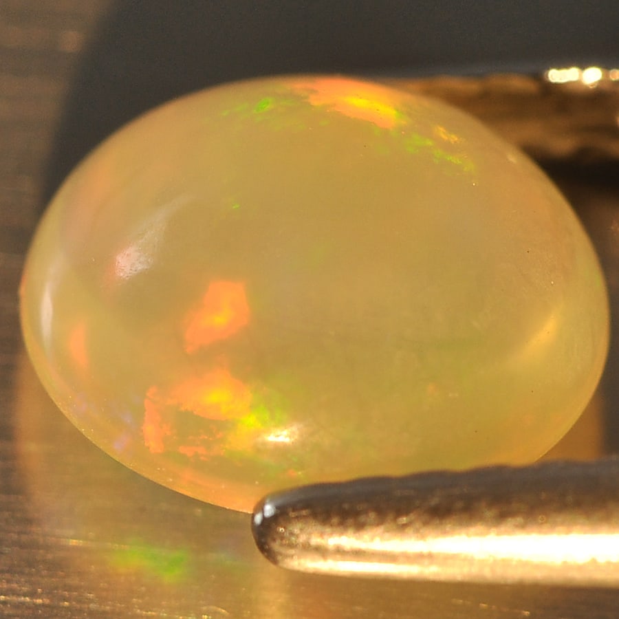 Natural Multi Color Opal Gemstones 1.18 Ct. Oval Cabochon Shape 8.2 x 7.3 Mm.: Product ID: 818715599 Product Name: Natural Opal Weight: 1.18 CT. Size: 8.2 x 7.3 x 4.5 MM. Shape: Oval Cabochon Color: Multi Color Clarity:Opaque Luster: Good Gems Origin: Ethiopia Treatment: Unheate