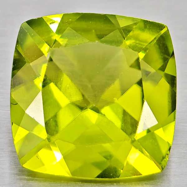 Natural Green Peridot Gemstones 1.33 Ct. Cushion Shape 7.2 x 7.1 Mm.: Product ID: 805317220 Product Name: Natural Peridot Weight: 1.33 CT. Size: 7.2 x 7.1 x 3.7 MM. Shape: Cushion Shape Color: Green Clarity:VSI - SI1 Luster: Good Gems Origin: Pakistan Treatment: Unheate