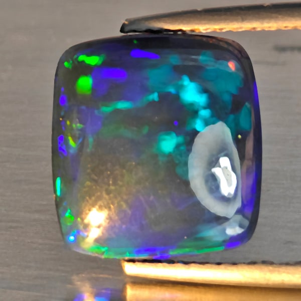 Natural Multi Color Play Of Colour Opal Gemstones 2.37 Ct. Cushion Cabochon Shape 12 x 11.2 Mm.: Product ID: 818728544 Product Name: Natural Opal Weight: 2.37 CT. Size: 12 x 11.2 x 3.4 MM. Shape: Cushion Cabochon Shape Color: Multi-Color Clarity:Semi - Transparent Luster: Good Gems Origin: Ethiop