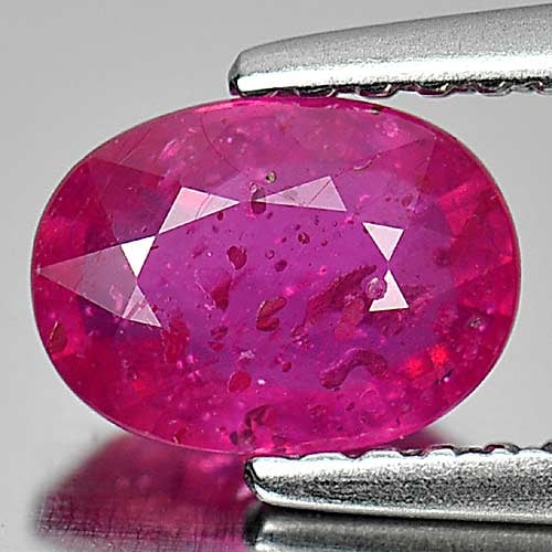 Natural Purplish Pink Ruby Gemstones 1.20 Ct. Oval Shape 7 x 5.2 Mm.: Product ID: 805926533 Product Name: Natural Ruby Weight: 1.20 CT. Size: 7 x 5.2 x 3.2 MM. Shape: Oval Color: Purplish Pink Clarity:VSI Luster: Good Gems Origin: Mozambique Treatment: Heated (Lead-glas
