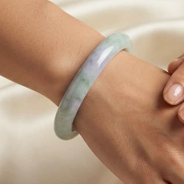 Natural Multi Color Jade Gemstones 313.76 Ct. Bangle Round Cabochon Shape 60 Mm: Product ID: 819816019 Product Name: Natural Jade Weight: 313.76 CT. Size: 76 x 60 x 13 MM. Shape: Bangle Round Cabochon Color: Multi-Color Clarity:Opaque Luster: Good Gems Origin: Thailand Treatment: 