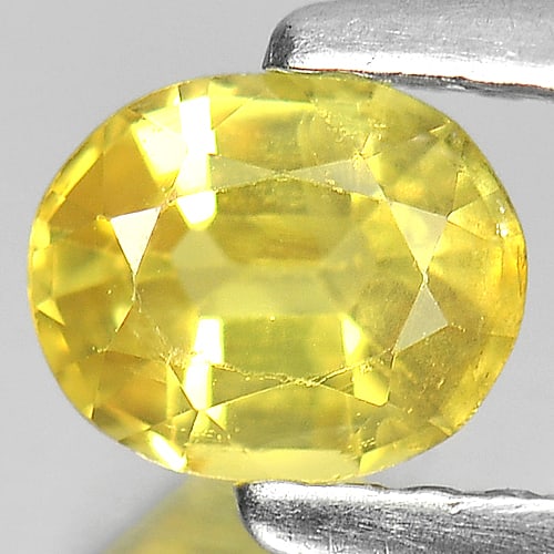 Natural Yellow Sapphire Gemstones 0.61 Ct. Oval Shape 5.6 x 4.5 Mm.: Product ID: 806160981 Product Name: Natural Yellow Sapphire Weight: 0.61 CT. Size: 5.6 x 4.5 x 3 MM. Shape: Oval Color: Yellow Clarity:VSI Luster: Good Gems Origin: Thailand Treatment: Heated Crystal 
