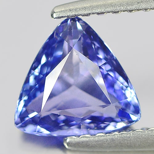 Natural Violet Tanzanite Gemstones 1.12 Ct. Trilliant Shape 6.85 x 6.78 Mm.: Product ID: 807004514 Product Name: Natural Tanzanite Weight: 1.12 CT. Size: 6.85 x 6.78 x 3.45 MM. Shape: Trilliant Color: Violet Clarity:IF Luster: Very Good Gems Origin: Tanzania Treatment: Heated 