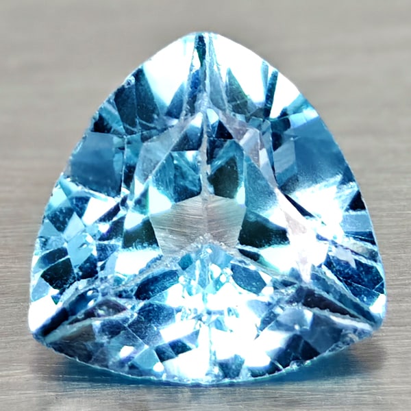 Natural Swiss Blue Topaz Gemstones 3.52 Ct. Trilliant Shape 9.8 Mm.: Product ID: 807167969 Product Name: Natural Blue Topaz Weight: 3.48 CT. Size: 9.8 x 9.8 x 5.8 MM. Shape: Trilliant Color: Swiss Blue Clarity:VSI Luster: Good Gems Origin: Brazil Treatment: Treated Cry