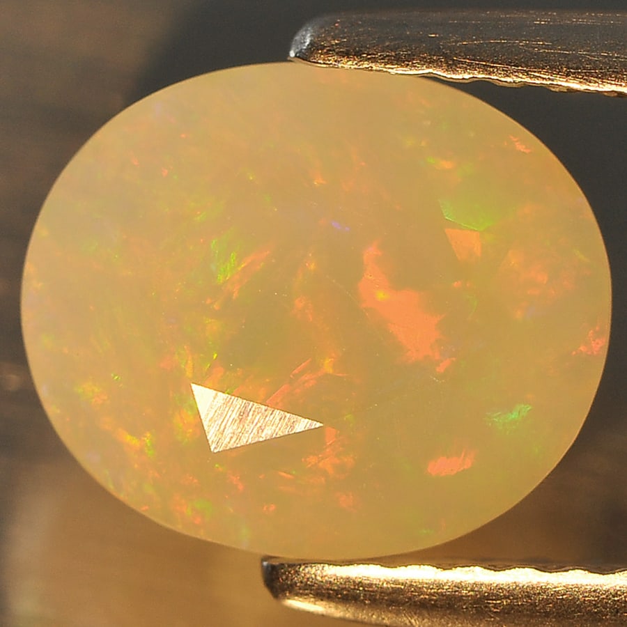 Natural Multi Color Opal Gemstones 1.62 Ct. Oval Shape 9.4 x 7.9 Mm.: Product ID: 818708885 Product Name: Natural Opal Weight: 1.62 CT. Size: 9.4 x 7.9 x 5.8 MM. Shape: Oval Color: Multi Color Clarity:Semi - Transparent Luster: Good Gems Origin: Ethiopia Treatment: Unhe