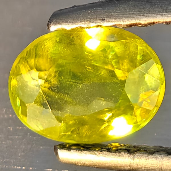 Natural Multi-Color Sphene Gemstones With Rainbow Spark 0.99 Ct. Oval Shape 6.9 x 5.4 Mm.: Product ID: 806509216 Product Name: Natural Sphene Weight: 0.99 CT. Size: 6.9 x 5.4 x 3.5 MM. Shape: Oval Shape Color: Multi-Color Clarity:SI1 Luster: Good Gems Origin: Madagascar Treatment: Unheated 