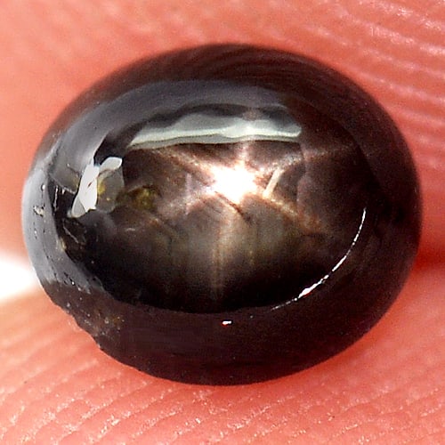Natural Black Star Sapphire Gemstones 0.84 Ct. Oval Cabochon Shape 5.4 x 4.7 Mm.: Product ID: 806132058 Product Name: Natural Star Sapphire Weight: 0.84 CT. Size: 5.4 x 4.7 x 3.2 MM. Shape: Oval Cabochon Color: Black Clarity:Opaque Luster: Good 6 Rays Star Gems Origin: Thailand Tre