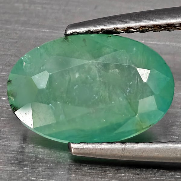 Natural Green Blueish Grandidierite Gemstones 2.85 Ct. Oval Shape 10.4 x 7.2 Mm.: Product ID: 803100048 Product Name: Natural Tsavorite Weight: 2.85 CT. Size: 10.4 x 7.2 x 4.5 MM. Shape: Oval Shape Color: Green Blueish Clarity:SI1 Luster: Good Gems Origin: Madagascar Treatment: Unh