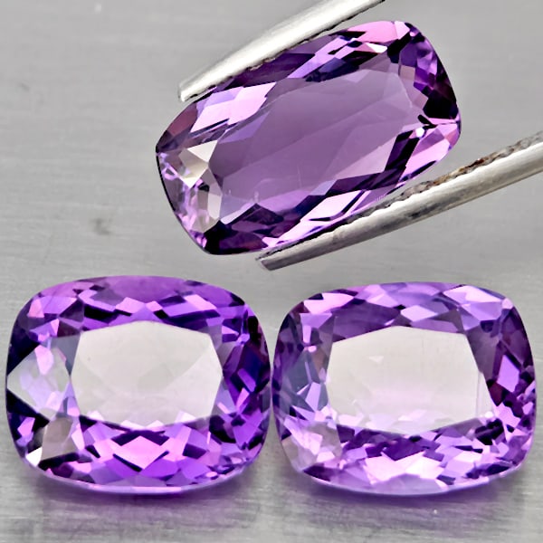 Natural Purple Amethyst Gemstones 10.98 Ct. 3 Pcs Cushion Shape 13.2 x 7.7 Mm.: Product ID: 800325620 Product Name: Natural Amethyst Weight: 10.98 CT. Size: 13.2 x 7.7 x 4.8 to 11.2 x 9.2 x 5.9 MM. Shape: Cushion Shape Color: Purple Clarity:VSI Luster: Good Gems Origin: Brazil Tr