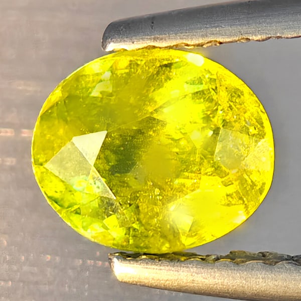 Natural Multi-Color With Rainbow Spark Sphene Gemstones 1.05 Ct. Oval Shape 6.8 x 5.8 Mm.: Product ID: 806509176 Product Name: Natural Sphene Weight: 1.05 CT. Size: 6.8 x 5.8 x 3.8 MM. Shape: Oval Shape Color: Multi-Color With Rainbow Spark Clarity:SI1 Luster: Good Gems Origin: Madagascar T