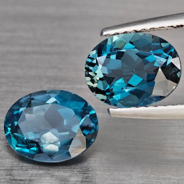 Natural London Blue Topaz Gemstones 4.69 Ct. 2 Pcs Oval Shape 9.2 x 7.2 Mm.: Product ID: 807168935 Product Name: Natural Blue Topaz Weight: 4.69 CT. Size: 9.2 x 7.2 x 5 MM. Shape: Oval Color: London Blue Clarity:SI1 Luster: Good Gems Origin: Brazil Treatment: Treated Crystal S