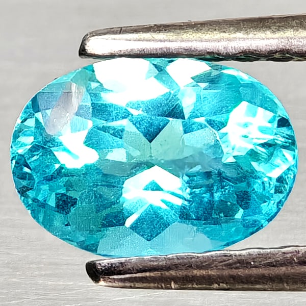 Natural Paraiba Color Apatite Gemstones 1.05 Ct. Oval Shape 6.9 x 5 Mm.: Product ID: 800613684 Product Name: Natural Apatite Weight: 1.05 CT. Size: 6.9 x 5 x 3.6 MM. Shape: Oval Color: Neon Blue Clarity:VSI Luster: Good Gems Origin: Tanzania Treatment: Unheated Crystal Str