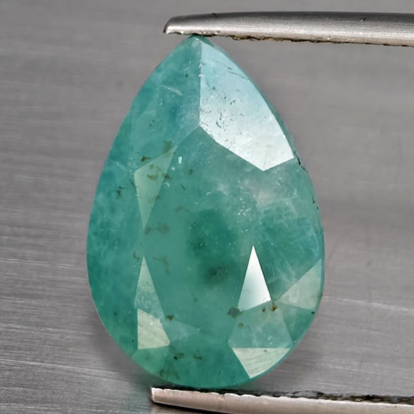 Natural Green Blueish Grandidierite Gemstones 7.45 Ct. Pear Shape 16.8 x 11.3 Mm.: Product ID: 803100029 Product Name: Natural Tsavorite Weight: 7.45 CT. Size: 16.8 x 11.3 x 7.1 MM. Shape: Pear Color: Green Blueish Clarity:SI1 Luster: Good Gems Origin: Madagascar Treatment: Unheated
