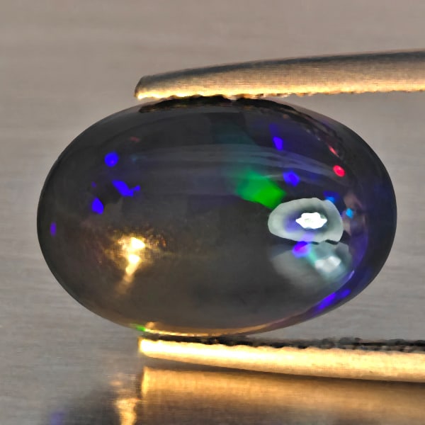 Natural Multi Color Play Of Color Rainbow Opal Gemstones 2.50 Ct. Oval Cabochon Shape 13 x 9 Mm.: Product ID: 818728618 Product Name: Natural Opal Weight: 2.50 CT. Size: 13 x 9 x 5 MM. Shape: Oval Cabochon Color: Multi-Color Clarity:Semi - Transparent Luster: Good Gems Origin: Ethiopia Treatment: 