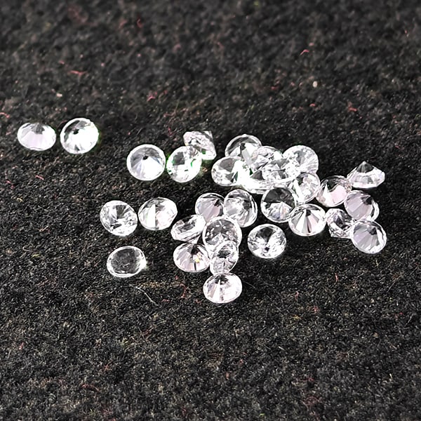 Natural White Zircon Gemstones 0.64 Ct. 30 Pcs. Round Diamond Cut 1.5 Mm.: Product ID: 807743156 Product Name: Natural Zircon Weight: 0.64 CT. Size: 1.5 x 1.5 x 1.2 MM. Shape: Round Diamond Cut Color: White Clarity:VSI Luster: Good Gems Origin: Cambodia Treatment: Heated Cry