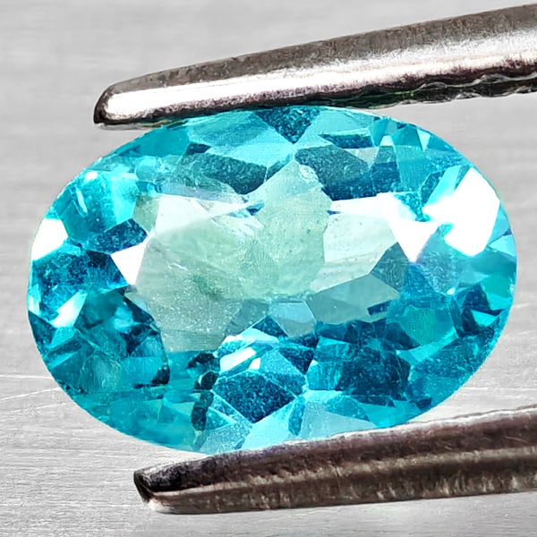Natural Paraiba Color Apatite Gemstones 0.76 Ct. Oval Shape 7.1 x 5.1 Mm.: Product ID: 800613726 Product Name: Natural Apatite Weight: 0.76 CT. Size: 7.1 x 5.1 x 3.2 MM. Shape: Oval Color: Neon Blue Clarity:VSI Luster: Good Gems Origin: Tanzania Treatment: Unheated Crystal S