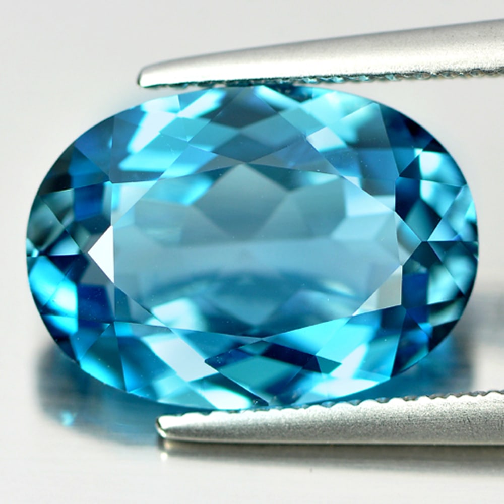 Natural London Blue Topaz Gemstones 7.06 Ct. Clean Oval Shape 14 x 9.9 Mm.: Product ID: 807165531 Product Name: Natural Blue Topaz Weight: 7.06 CT. Size: 14 x 9.9 x 5.9 MM. Shape: Oval Color: Blue Clarity:IF Luster: Very Good Gems Origin: Brazil Treatment: Treated Crystal Str
