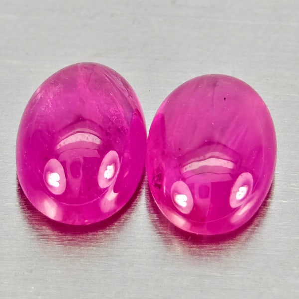 Natural Pink Red Jonson Ruby Gemstones 1.63 Ct. 2 Pcs. Oval Cabochon Shape 6.5 x 4.4 Mm.: Product ID: 805935743 Product Name: Natural Ruby Weight: 1.63 CT. Size: 6.5 x 4.4 x 2.6 MM. Shape: Oval Cabochon Color: Pink Red Clarity:Semi - Transparent Luster: Good Gems Origin: Mozambique Treatme