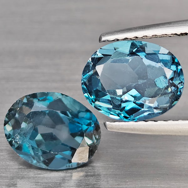 Natural London Blue Topaz Gemstones 4.89 Ct. 2 Pcs. Oval Shape 9 x 7 Mm.: Product ID: 807168919 Product Name: Natural Blue Topaz Weight: 4.89 CT. Size: 9 x 7 x 5.1 MM. Shape: Oval Color: London Blue Clarity:VSI Luster: Good Gems Origin: Brazil Treatment: Treated Crystal Str