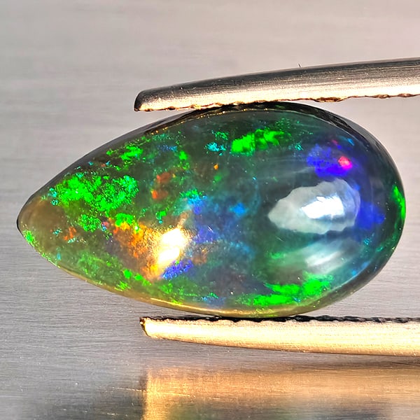Natural Multi Color Play Of Color Rainbow Opal Gemstones 2.07 Ct. Pear Cabochon Shape 15 x 8.4 Mm.: Product ID: 818728649 Product Name: Natural Opal Weight: 2.07 CT. Size: 15 x 8.4 x 4.1 MM. Shape: Pear Cabochon Color: Multi-Color Clarity:Semi - Transparent Luster: Good Gems Origin: Ethiopia Treatme