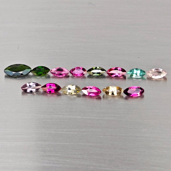 Natural Multi Color Tourmaline Gemstones 2.02 Ct. 14 Pcs. Marquise Shape And Mixed Size: Product ID: 807251662 Product Name: Natural Tourmaline Weight: 2.02 CT. Size: 7.2 x 3.5 x 2 to 4.9 x 2.5 x 2 MM. Shape: Marquise Shape Color: Fancy Color Clarity:SI1 Luster: Good Gems Origin: Nigeria 