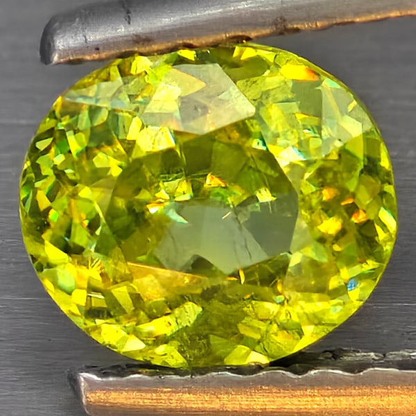 Natural Multi-Color Sphene Gemstones With Rainbow Spark 0.65 Ct. Oval Shape 6 x 5.3 Mm.: Product ID: 806509298 Product Name: Natural Sphene Weight: 0.65 CT. Size: 6 x 5.3 x 3.3 MM. Shape: Oval Color: Multi-Color Clarity:SI1 Luster: Good Gems Origin: Madagascar Treatment: Unheated Crystal 