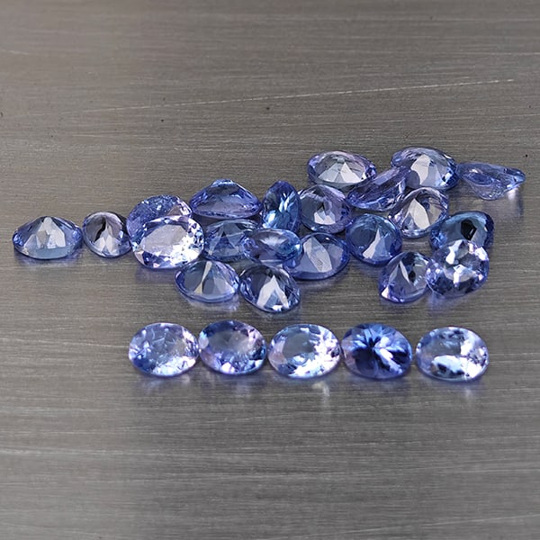 Natural Violetish Blue Tanzanite Gemstones 2.63 Ct. 20 Pcs. Oval Shape 4 x 2.8 Mm.: Product ID: 807015130 Product Name: Natural Tanzanite Weight: 2.63 CT. Size: 4 x 2.8 x 1.7 MM. Shape: Oval Color: Violetish Blue Clarity:VSI Luster: Good Gems Origin: Tanzania Treatment: Heated Crysta