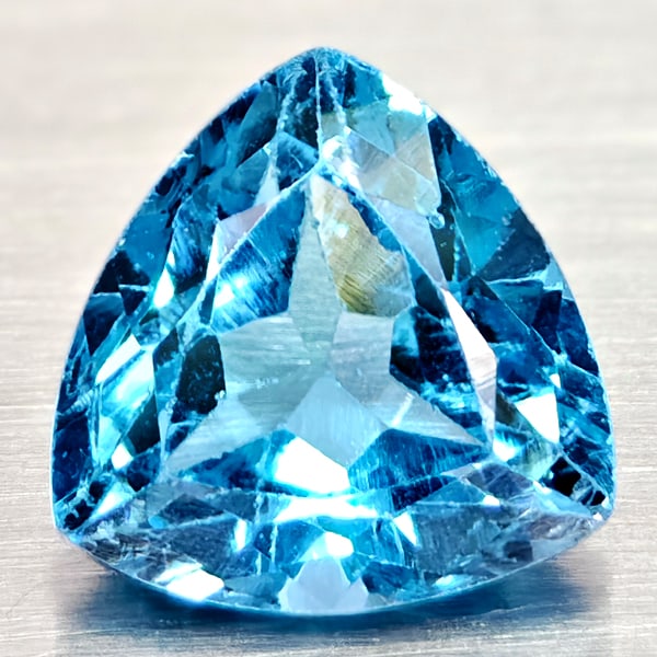 Natural Swiss Blue Topaz Gemstones 2.89 Ct. Trilliant Shape 8.9 Mm.: Product ID: 807167983 Product Name: Natural Blue Topaz Weight: 2.89 CT. Size: 8.9 x 8.9 x 5.4 MM. Shape: Trilliant Color: Swiss Blue Clarity:VSI Luster: Good Gems Origin: Brazil Treatment: Treated Cry