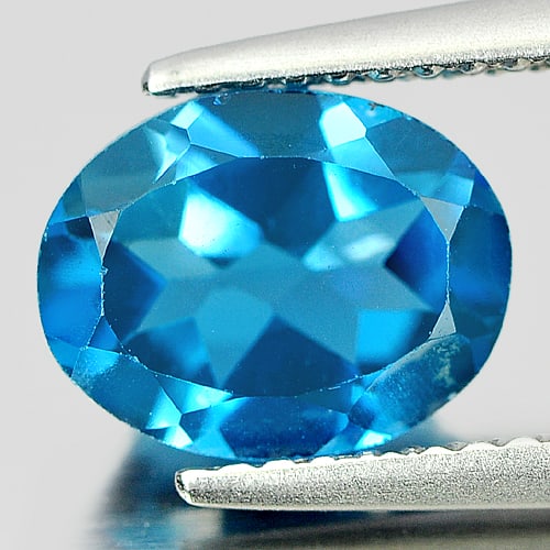 Natural London Blue Topaz Gemstones 2.33 Ct. Oval Shape 8.2 x 7.3 Mm.: Product ID: 807161004 Product Name: Natural Blue Topaz Weight: 2.33 CT. Size: 8.2 x 7.3 x 4.5 MM. Shape: Oval Color: London Blue Clarity:VSI Luster: Good Gems Origin: Brazil Treatment: Treated Crystal