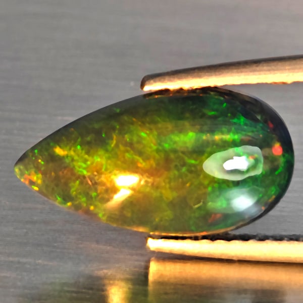 Natural Multi Color Play Of Color Rainbow Opal Gemstones 1.96 Ct. Pear Cabochon Shape 15.1 x 8.1 Mm.: Product ID: 818728650 Product Name: Natural Opal Weight: 1.96 CT. Size: 15.1 x 8.1 x 4 MM. Shape: Pear Cabochon Color: Multi-Color Clarity:Semi - Transparent Luster: Good Gems Origin: Ethiopia Treatme