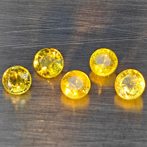 Natural Greenish Yellow Titanium Sphene Gemstones Rainbow Spark 1.12 Ct. 10 Pcs. Round Shape 4 Mm.: Product ID: 806509430 Product Name: Natural Sphene Weight: 1.12 CT. Size: 3.4 x 3.4 x 2.3 MM. Shape: Round Color: Greenish Yellow Titanium Rainbow Spark Clarity:SI1 Luster: Good Gems Origin: Madagasca