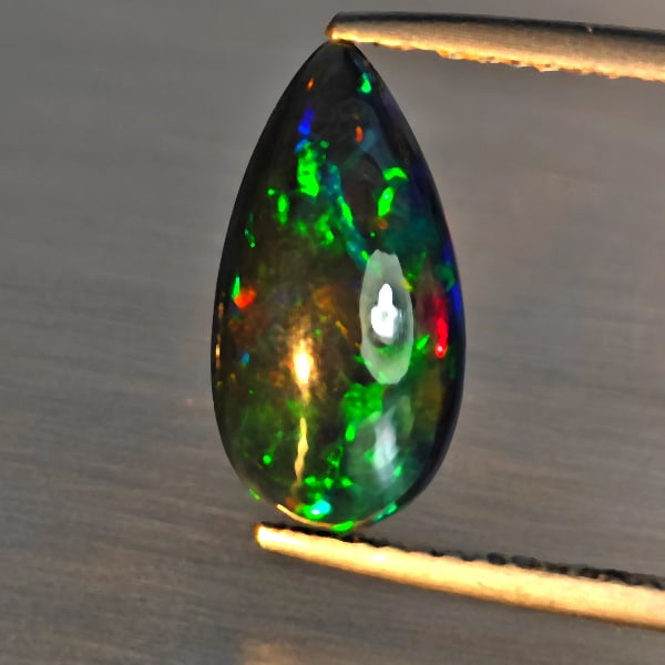 Natural Multi Color Play Of Color Rainbow Opal Gemstones 1.92 Ct. Pear Cabochon Shape 14 x 9.2 Mm.: Product ID: 818728632 Product Name: Natural Opal Weight: 1.92 CT. Size: 14 x 9.2 x 4.7 MM. Shape: Pear Cabochon Color: Multi-Color Clarity:Semi - Transparent Luster: Good Gems Origin: Ethiopia Treatme