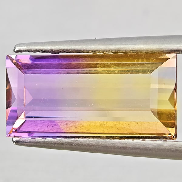 Natural Bi Color Ametrine Gemstones 4.25 Ct. Baguette Shape 14.2 x 7 Mm.: Product ID: 800408559 Product Name: Natural Ametrine Weight: 4.25 CT. Size: 14.2 x 7 x 5 MM. Shape: Baguette Color: Bi Color Clarity:VSI Luster: Good Gems Origin: Bolivia Treatment: Unheated Crystal S