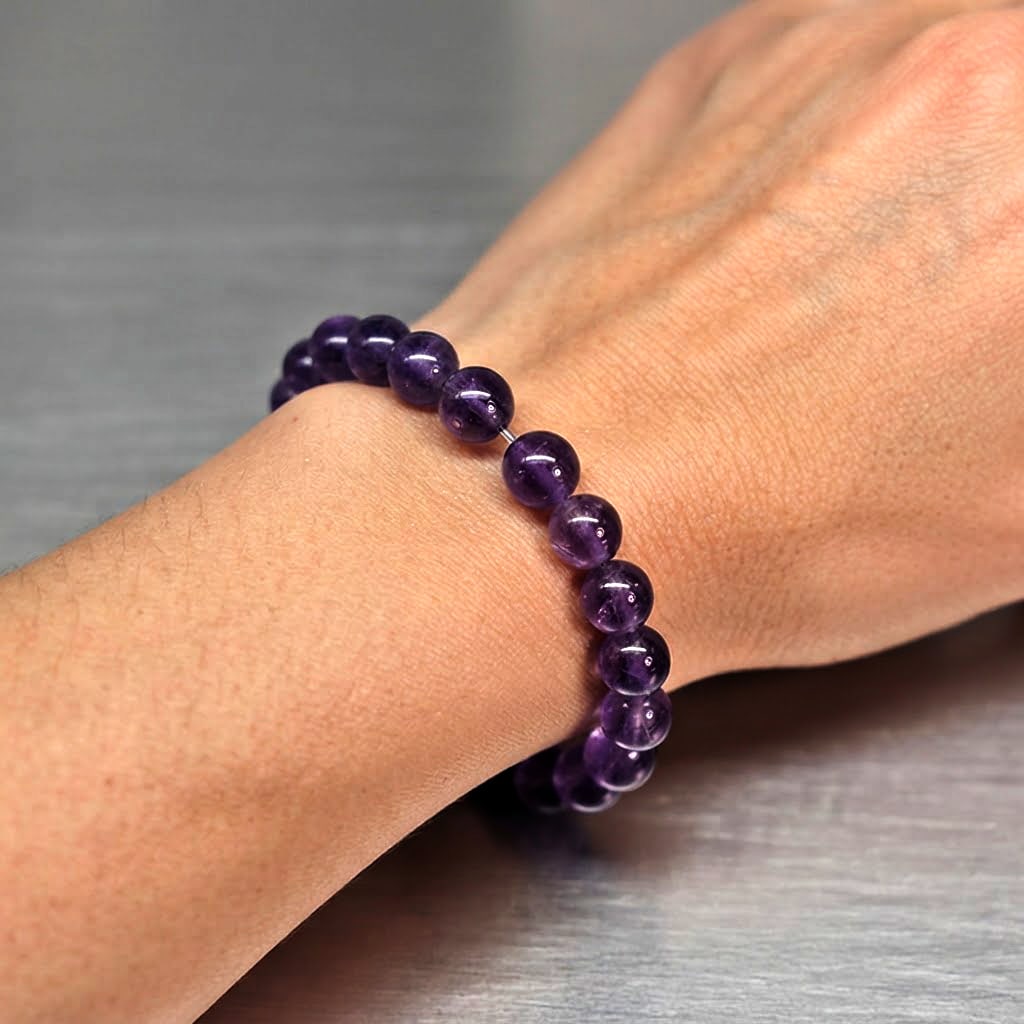 Natural Purple Amethyst Gemstones 46.52Ct. Round Cabochon Shape Flexibility Bracelet Length 6 Inch.: Product ID: 800325880 Product Name: Natural Amethyst Weight: 46.52 CT. Size: 6 Mm. MM. Shape: Round Cabochon Color: Purple Clarity:None Luster: None Gems Origin: Brazil Treatment: Unheated Crystal Str
