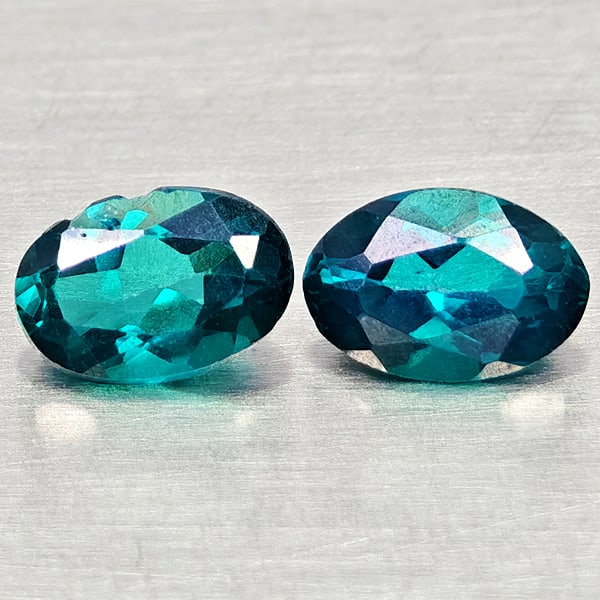 Natural Bluish Green Topaz Gemstones 1.02 Ct. 2 Pcs. Oval Shape 5.9 x 4 Mm.: Product ID: 807168088 Product Name: Natural Topaz Weight: 1.02 CT. Size: 5.9 x 4 x 2.7 MM. Shape: Oval Color: Bluish Green Clarity:VSI Luster: Good Gems Origin: Brazil Treatment: Treated Crystal Struc