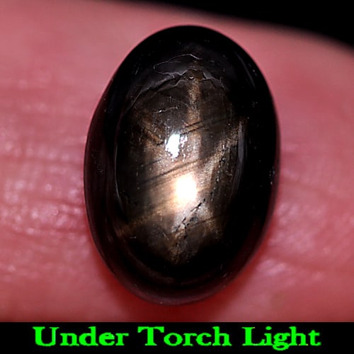 Natural Black Star Sapphire Gemstones 6.87 Ct. Oval Cabochon Shape 12 x 8.4 Mm.: Product ID: 806155159 Product Name: Natural Star Sapphire Weight: 6.87 CT. Size: 12 x 8.4 x 5.9 MM. Shape: Oval Cabochon Color: Black Clarity:Opaque Luster: Good 6 Rays Star Gems Origin: Thailand Trea