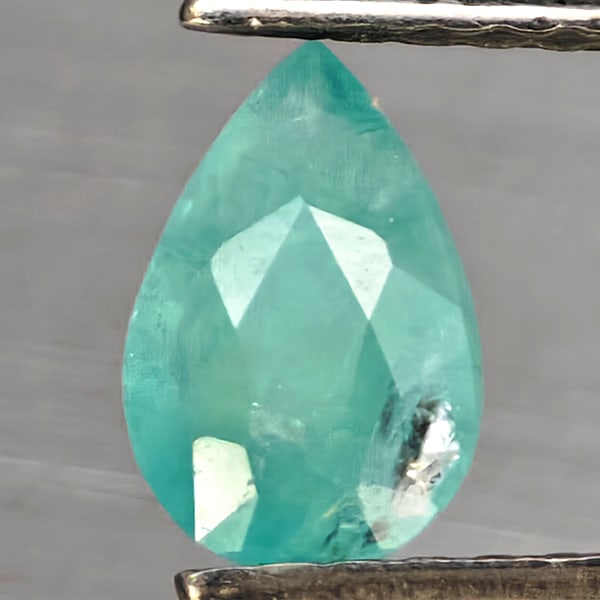 Natural Green Blueish Grandidierite Gemstones 1.10 Ct. Pear Shape 7 x 4.7 Mm.: Product ID: 803100107 Product Name: Natural Tsavorite Weight: 1.10 CT. Size: 7 x 4.7 x 5.6 MM. Shape: Pear Color: Green Blueish Clarity:SI1 Luster: Good Gems Origin: Madagascar Treatment: Unheated Cry