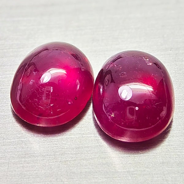 Natural Purplish Red Ruby Gemstones 9.12 Ct. 2 Pcs Oval Cabochon Shape Mixed Size: Product ID: 805935237 Product Name: Natural Ruby Weight: 9.12 CT. Size: 10.2 x 8.2 x 5.5 to 10.1 x 8.1 x 5.2 MM. Shape: Oval Cabochon Color: Purplish Red Clarity:Semi - Transparent Luster: Good Gems O