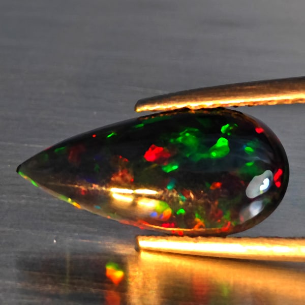 Natural Multi Color Play Of Color Rainbow Opal Gemstones 1.47 Ct. Pear Cabochon Shape 15.7 x 7.5 Mm.: Product ID: 818728643 Product Name: Natural Opal Weight: 1.47 CT. Size: 15.7 x 7.5 x 3.1 MM. Shape: Pear Cabochon Color: Multi-Color Clarity:Semi - Transparent Luster: Good Gems Origin: Ethiopia Treat