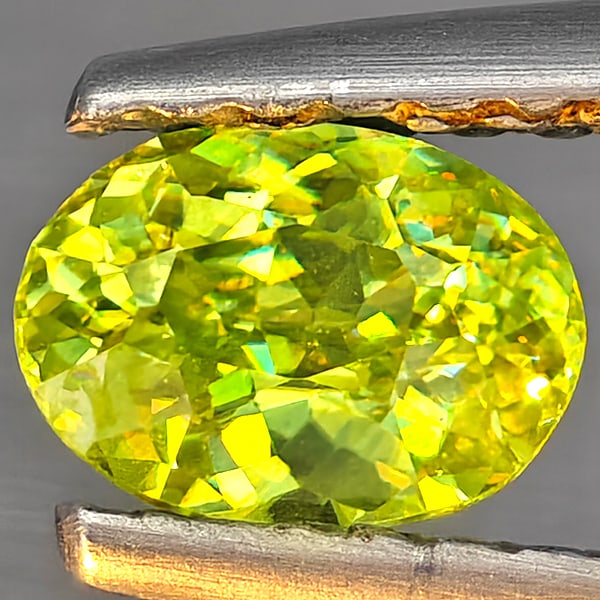 Natural Multi-Color Sphene Gemstones With Rainbow Spark 0.41 Ct. Oval Shape 5.6 x 4.1 Mm.: Product ID: 806509277 Product Name: Natural Sphene Weight: 0.41 CT. Size: 5.6 x 4.1 x 2.8 MM. Shape: Oval Color: Multi-Color Clarity:SI1 Luster: Good Gems Origin: Madagascar Treatment: Unheated Crysta