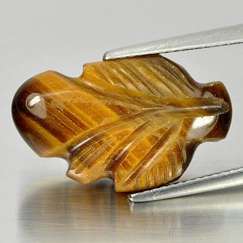 Natural Golden Tiger Eye Gemstones 12.76 Ct. Carving Leaves Shape 21 x 13 Mm.: Product ID: 811600066 Product Name: Natural Tiger eye Weight: 12.76 CT. Size: 21 x 13 x 6.4 MM. Shape: Carving Leaves Color: Golden Clarity:Opaque Luster: Good Gems Origin: Thailand Treatment: Unheate