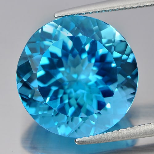 Natural Swiss Blue Topaz Gemstones 14.28 Ct. Clean Round Cornflower Cut 15.1 Mm.: Product ID: 807166406 Product Name: Natural Blue Topaz Weight: 14.28 CT. Size: 15.1 x 15.1 x 9.3 MM. Shape: Round Cornflower Cut Color: Blue Clarity:IF Luster: Good Gems Origin: Brazil Treatment: Trea
